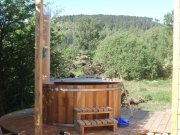 An image showing the hot tub and views from Loch Ken Eco Bothies self catering accommodation eco ret